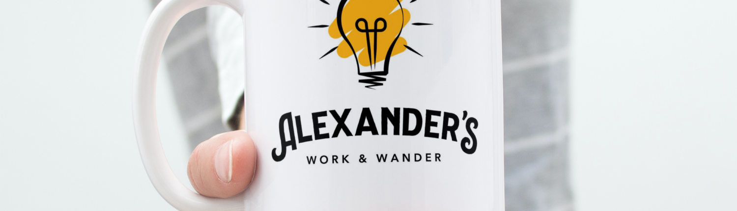 Alexander's Work and Wander Coffee Mug held out in lady's hand
