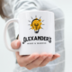 Alexander's Work and Wander Coffee Mug held out in lady's hand